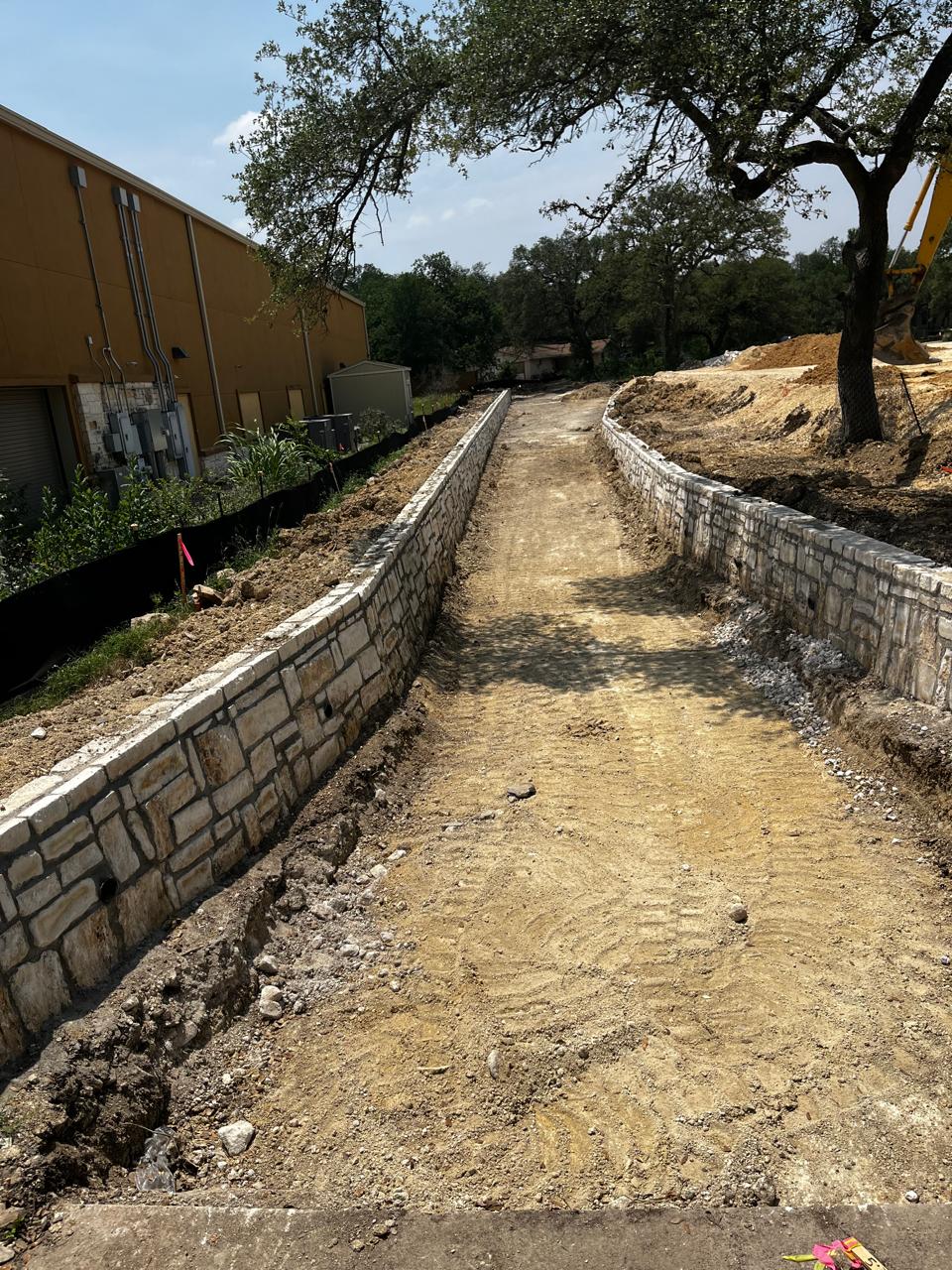 Rubble masonry gravity retaining wall at Taylor Industrial Park in Taylor, Texas