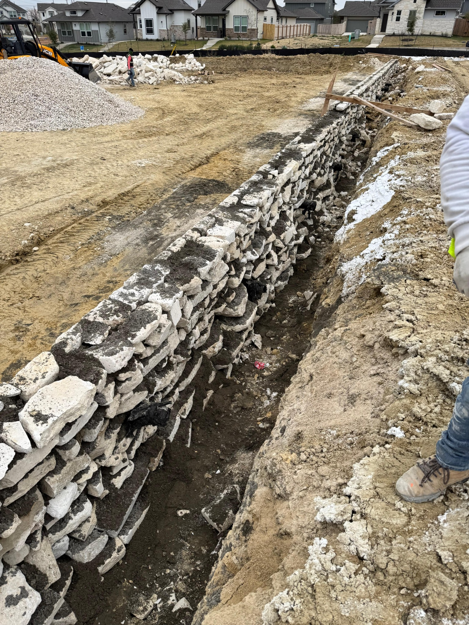 Natural stone gravity wall during construction